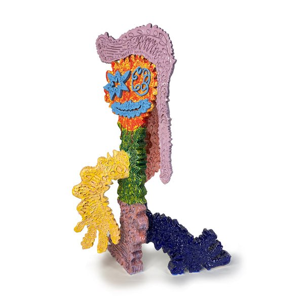 Figure With Turquoise Eyes and Mouth With Red Yellow Face