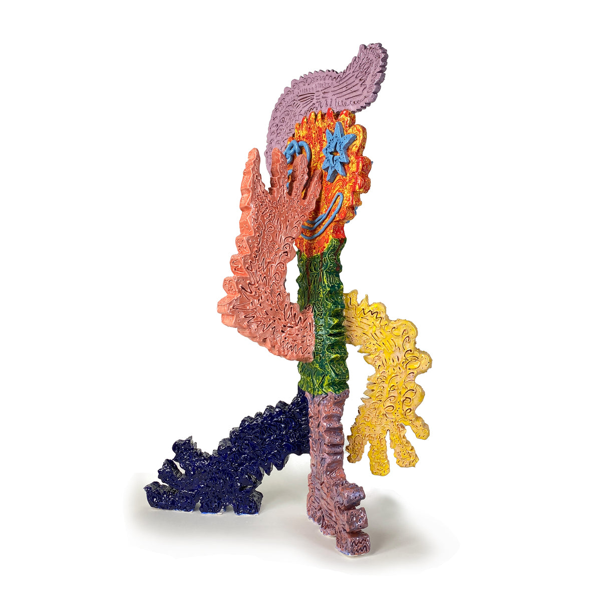 Figure With Turquoise Eyes and Mouth With Red Yellow Face